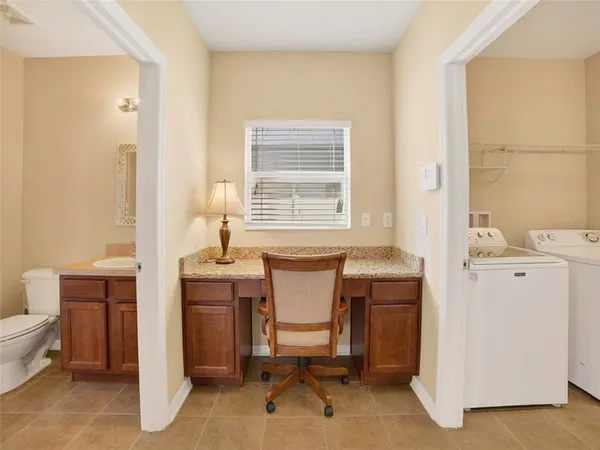 a work room with furniture and windows