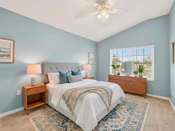 a bed room with a bed and a window