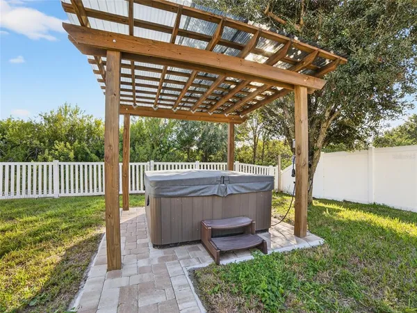 a view of a chair and table in the garden