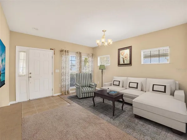 a living room with furniture and a window