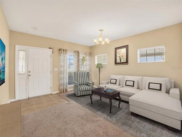 a living room with furniture and a window