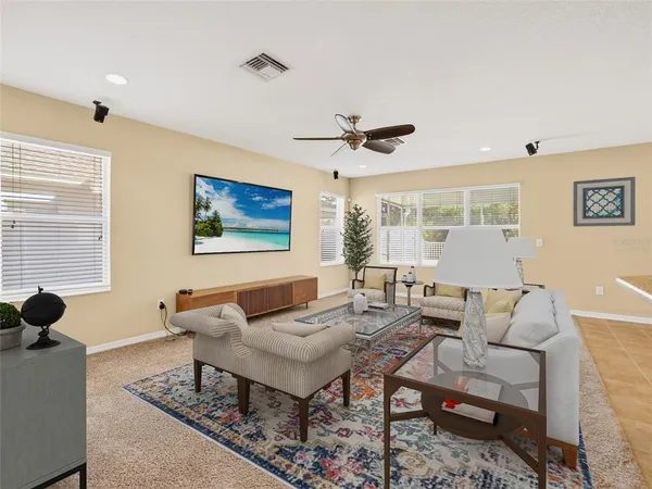 a living room with furniture and a large window