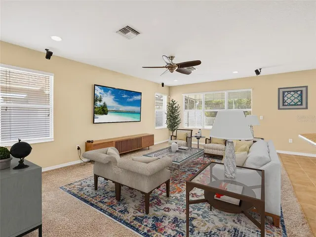 a living room with furniture and a large window