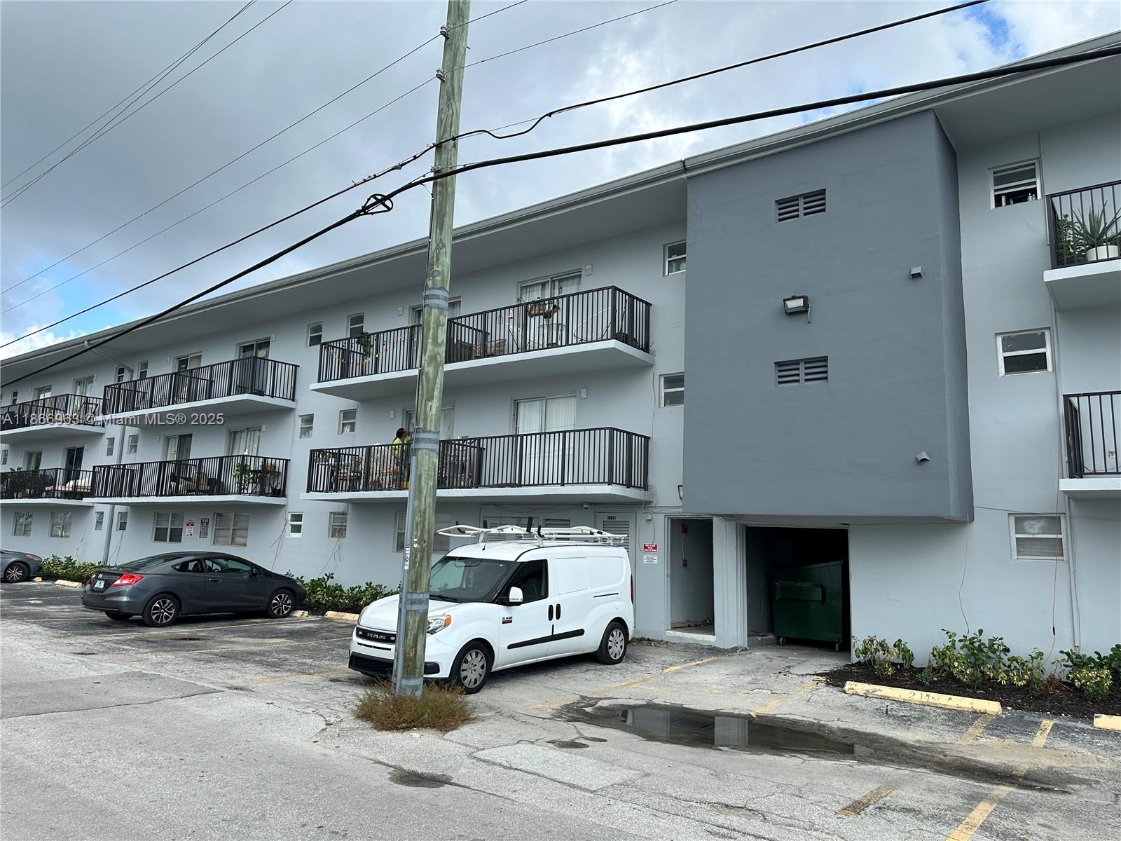 a living room with furniture a fireplace and book shelf