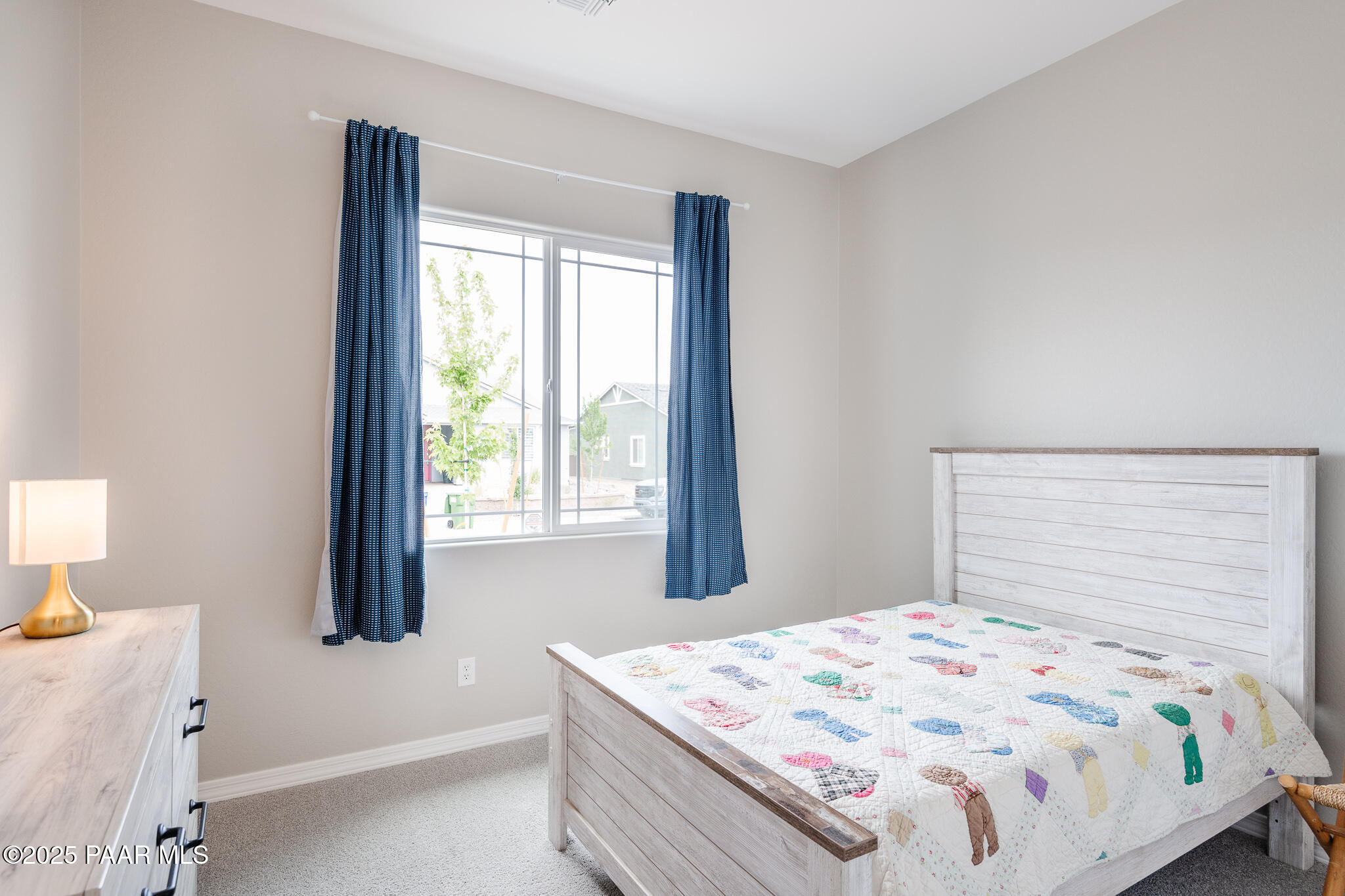 7091 Turquoise Street Prescott, AZ 86305 - Photo 12 of 27 a bedroom with a bed and a window