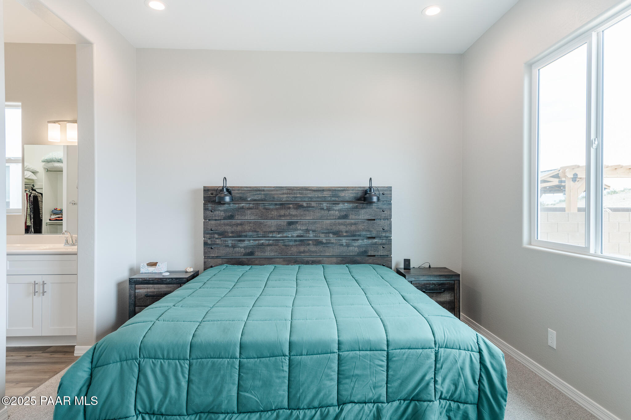 7091 Turquoise Street Prescott, AZ 86305 - Photo 16 of 27 a bedroom with a bed and window