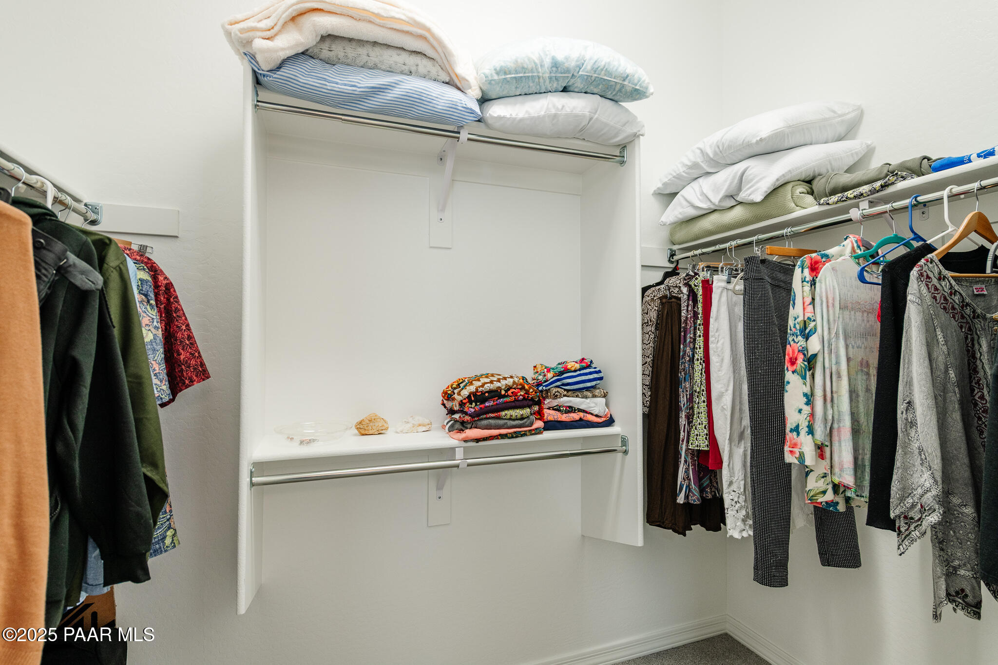 7091 Turquoise Street Prescott, AZ 86305 - Photo 18 of 27 a view of walk in closet with clothes and shoes