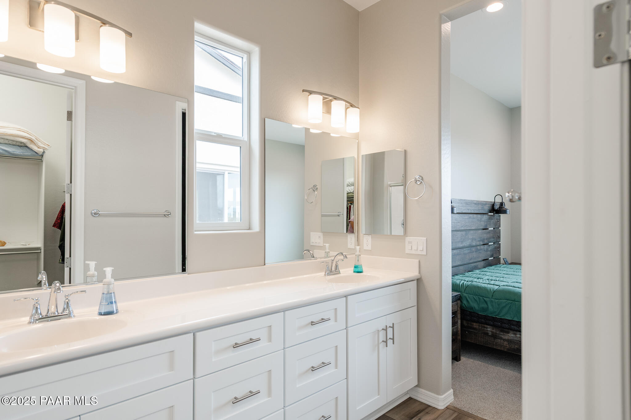 7091 Turquoise Street Prescott, AZ 86305 - Photo 19 of 27 a bathroom with a double vanity sink and a mirror