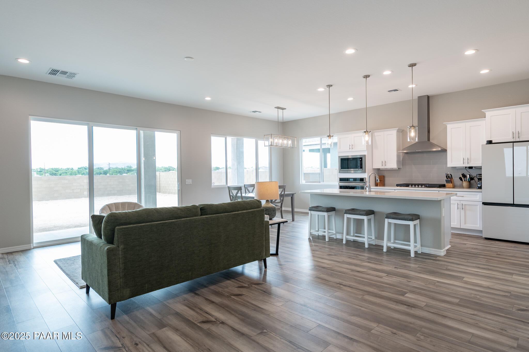 7091 Turquoise Street Prescott, AZ 86305 - Photo 20 of 27 a living room with furniture and a wooden floor