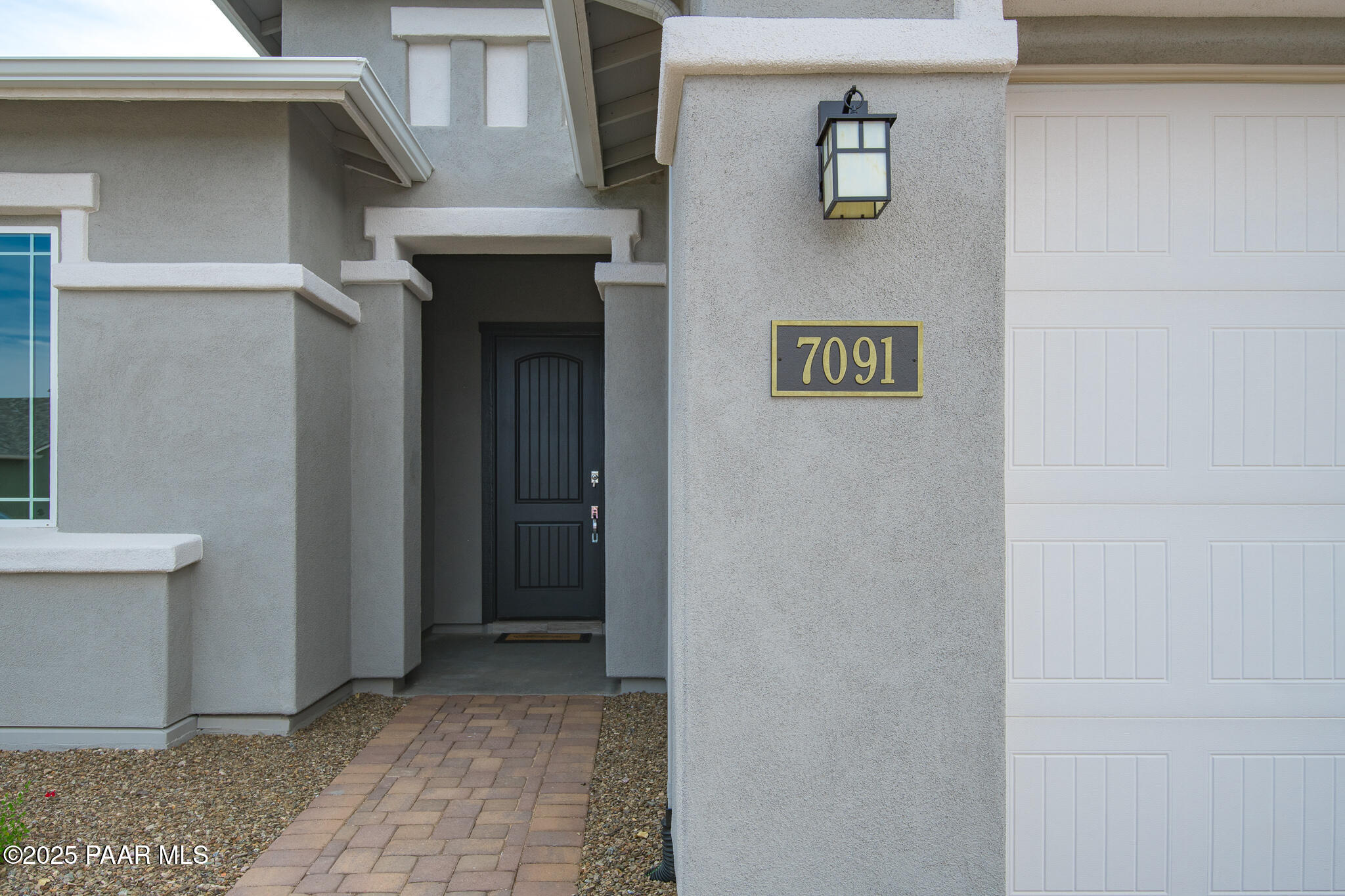 7091 Turquoise Street Prescott, AZ 86305 - Photo 3 of 27 a view of a hallway with brick walls
