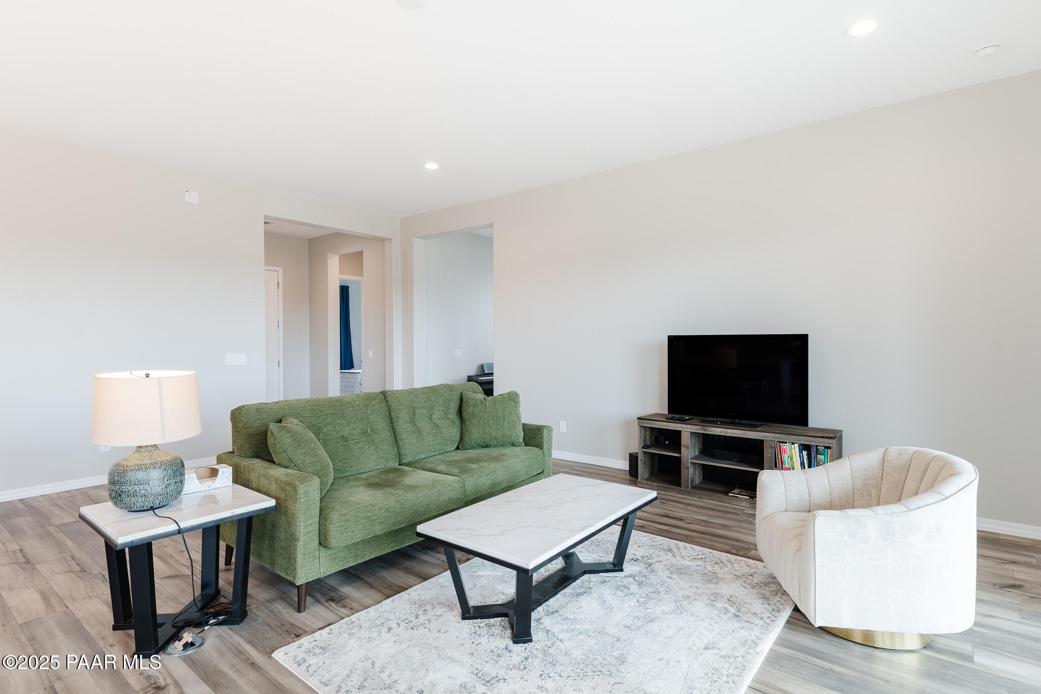 7091 Turquoise Street Prescott, AZ 86305 - Photo 5 of 27 a living room with furniture and a flat screen tv