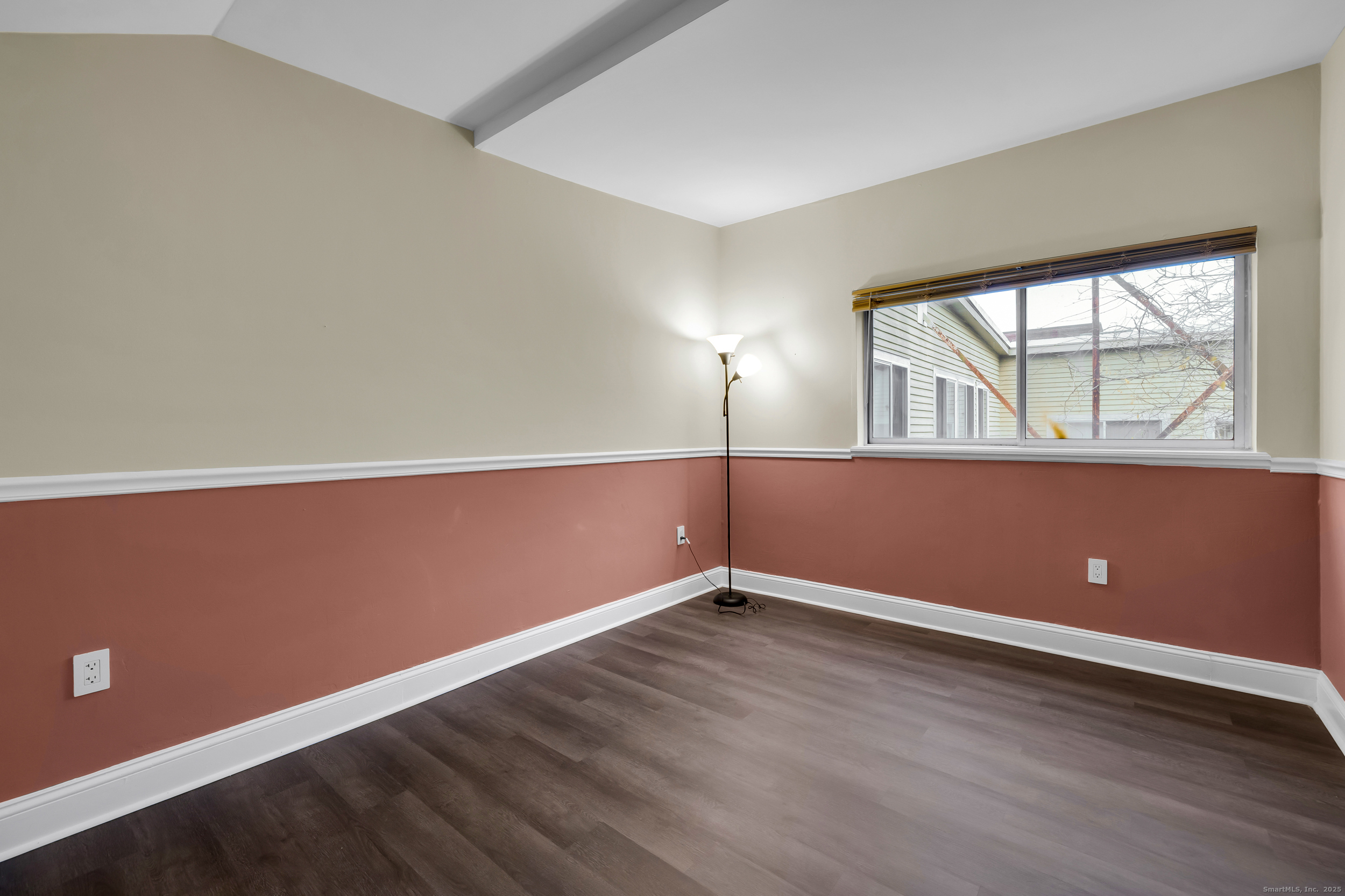 1 Front Street, Unit 113 New Haven, CT 06513 - Photo 14 of 22 an empty room with wooden floor and windows