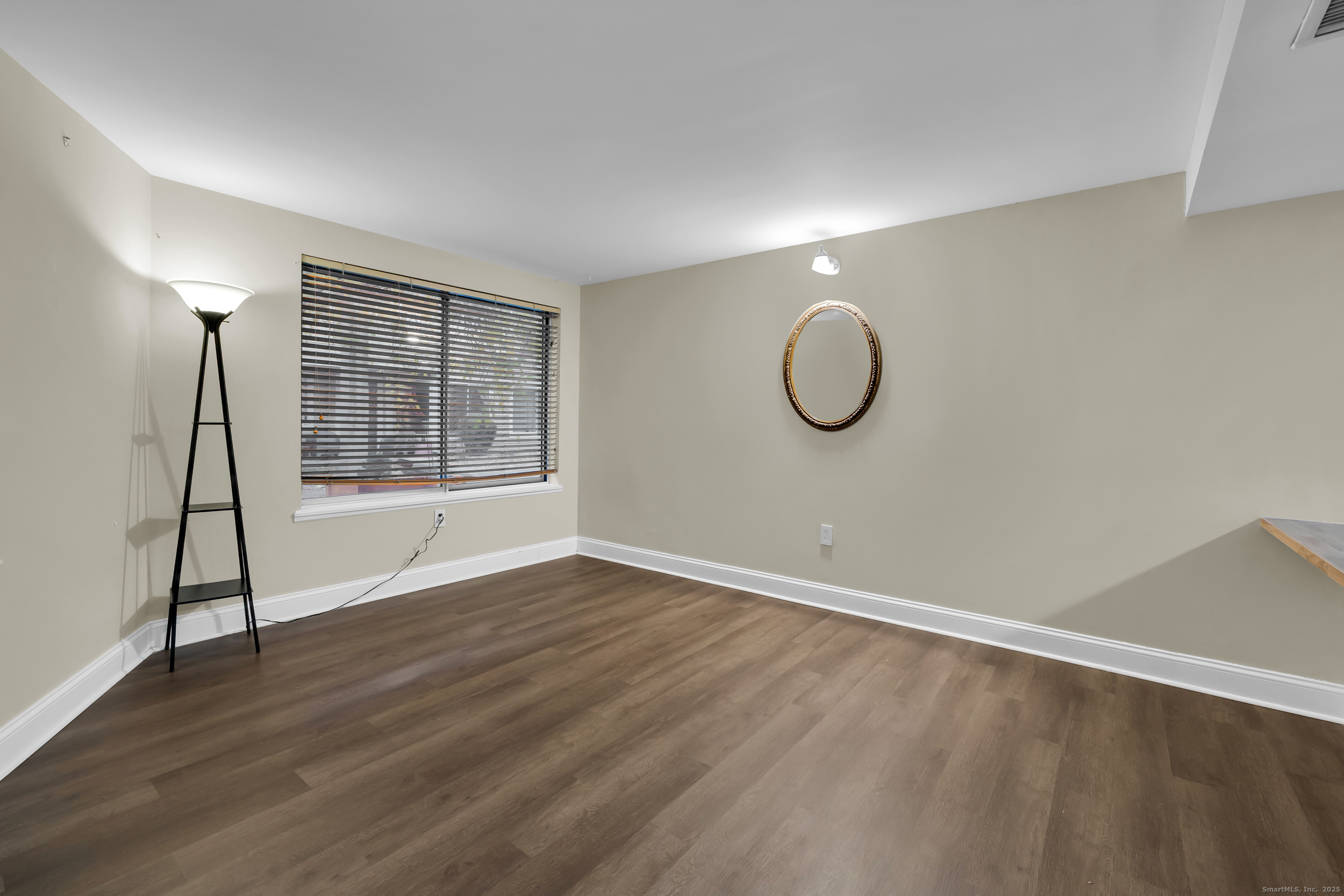 1 Front Street, Unit 113 New Haven, CT 06513 - Photo 4 of 22 a view of room with wooden floor and window