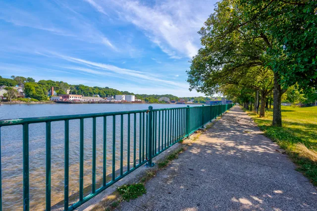 a balcony with trees in the back yard