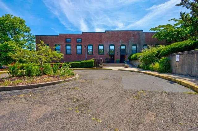 a view of a building with a yard