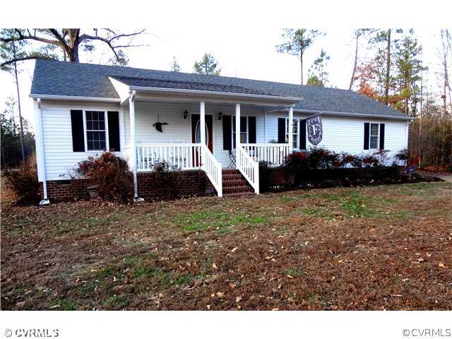 20310 Halligan Park Road Carson, VA 23830 - Photo 1 of 24 a front view of a house with a garden