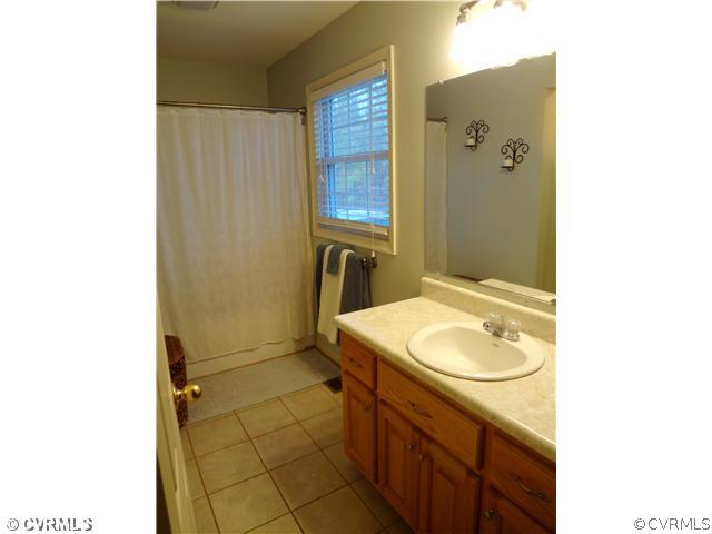 20310 Halligan Park Road Carson, VA 23830 - Photo 17 of 24 a bathroom with a sink and a mirror