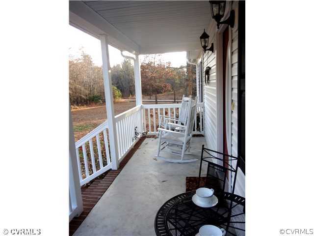 20310 Halligan Park Road Carson, VA 23830 - Photo 3 of 24 a living room with furniture and a floor to ceiling window