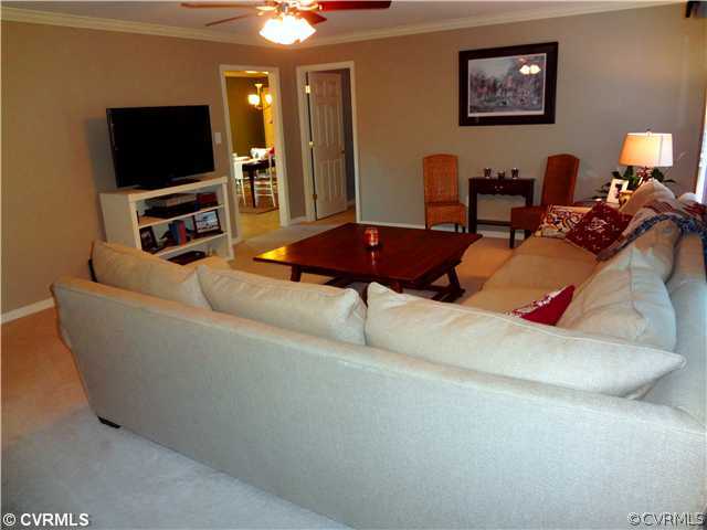 20310 Halligan Park Road Carson, VA 23830 - Photo 6 of 24 a living room with furniture and a flat screen tv