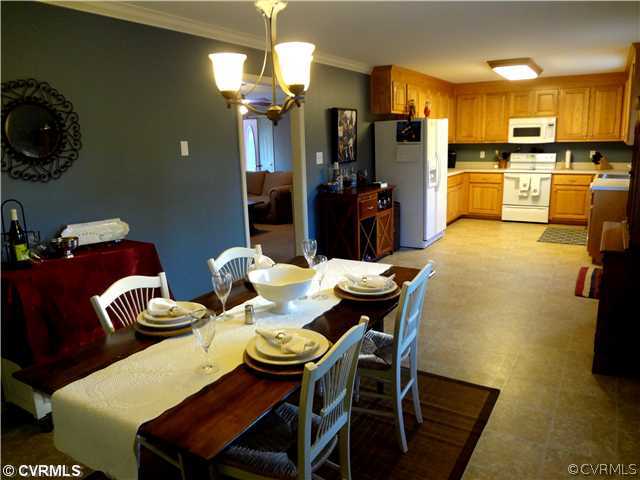 20310 Halligan Park Road Carson, VA 23830 - Photo 9 of 24 a view of a dining room with furniture and chandelier