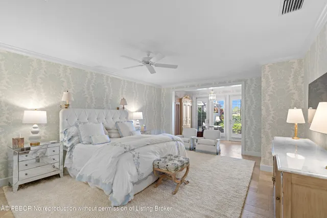 a view of a house with a table and chairs in patio