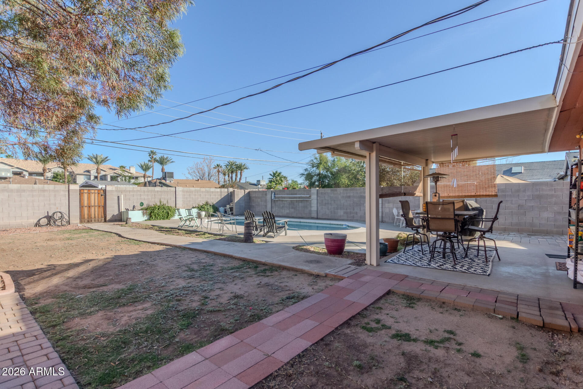 4413 North 19th Place Phoenix, AZ 85016 - Photo 12 of 14 a view of a backyard with table and chairs