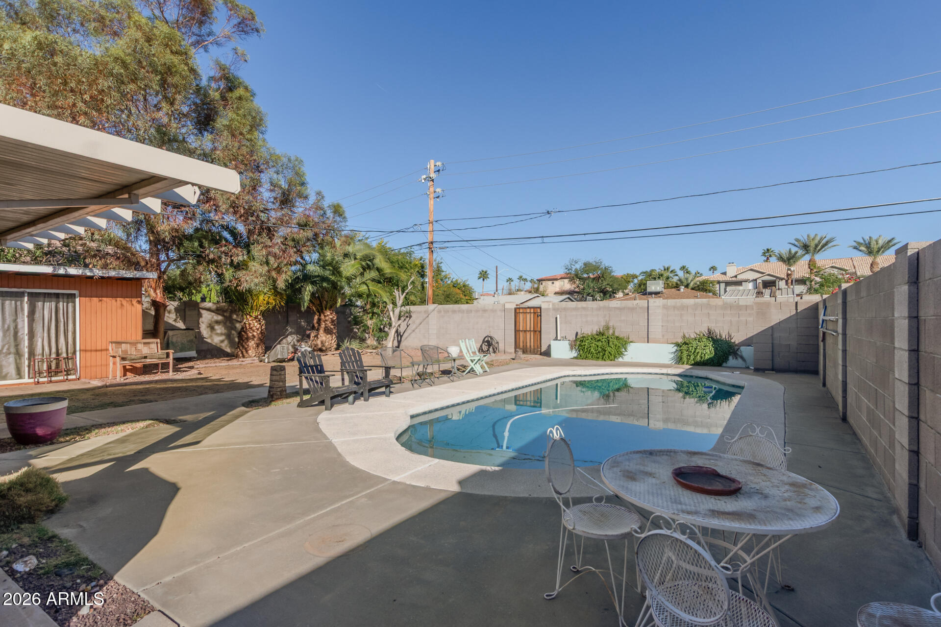 4413 North 19th Place Phoenix, AZ 85016 - Photo 14 of 14 a view of a swimming pool with outdoor seating and plants