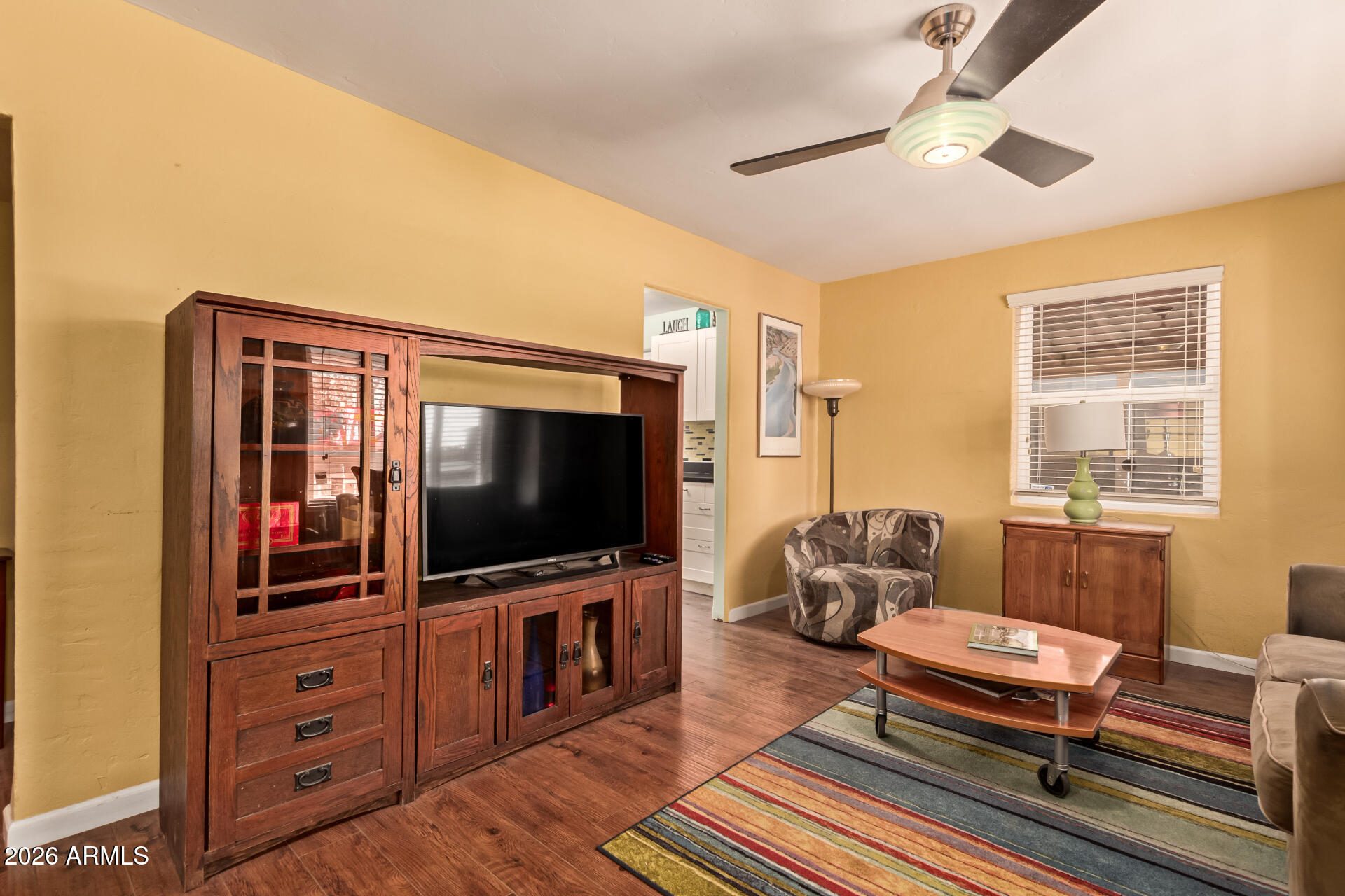 4413 North 19th Place Phoenix, AZ 85016 - Photo 2 of 14 a living room with furniture and a flat screen tv