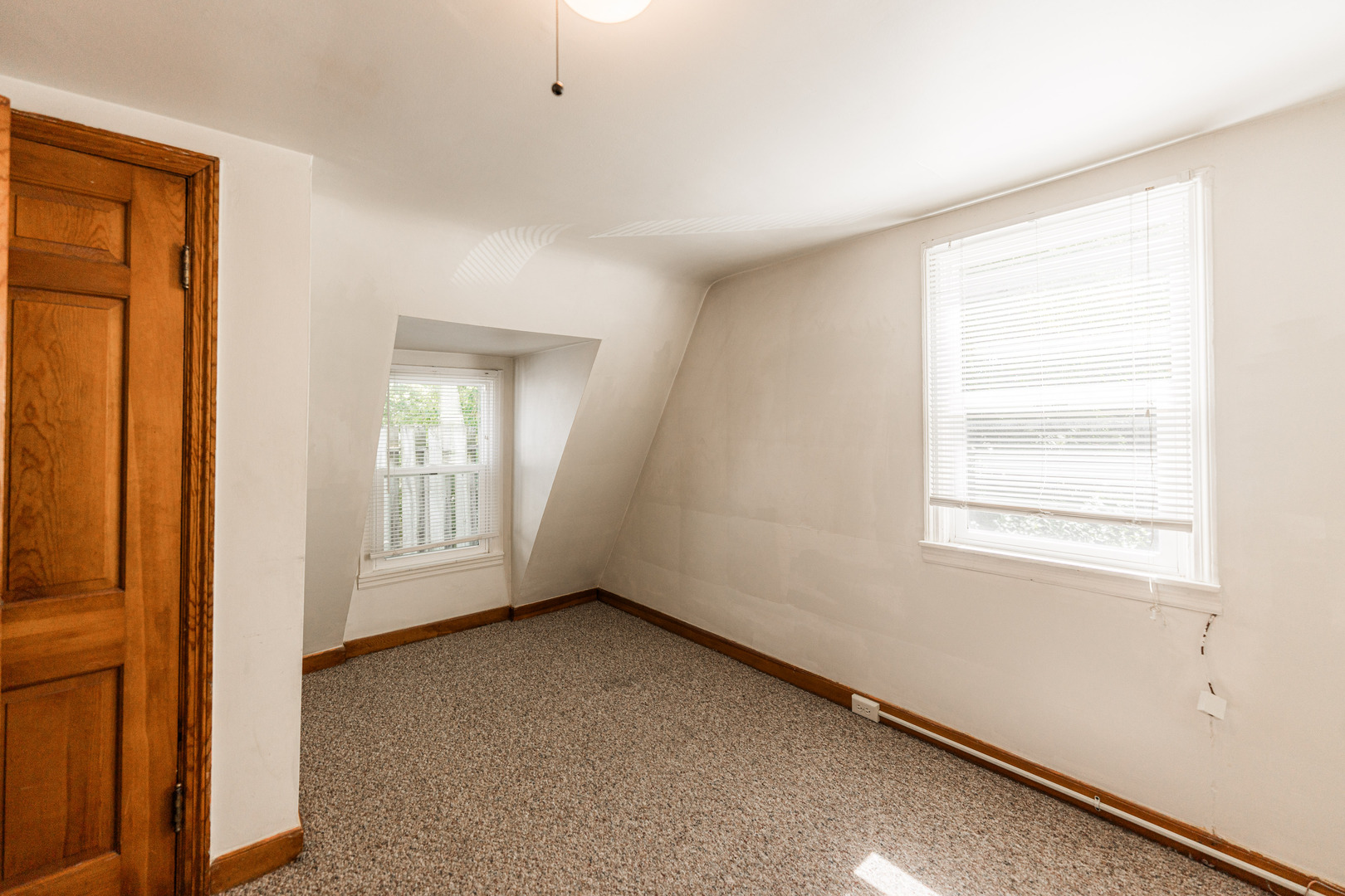 512 North 6th Street, Unit 2 DeKalb, IL 60115 - Photo 12 of 16 a view of an empty room with a window
