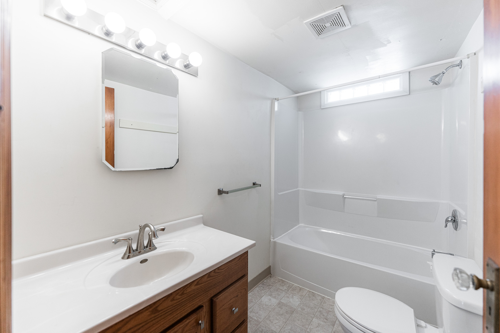 512 North 6th Street, Unit 2 DeKalb, IL 60115 - Photo 14 of 16 a bathroom with a sink toilet and shower