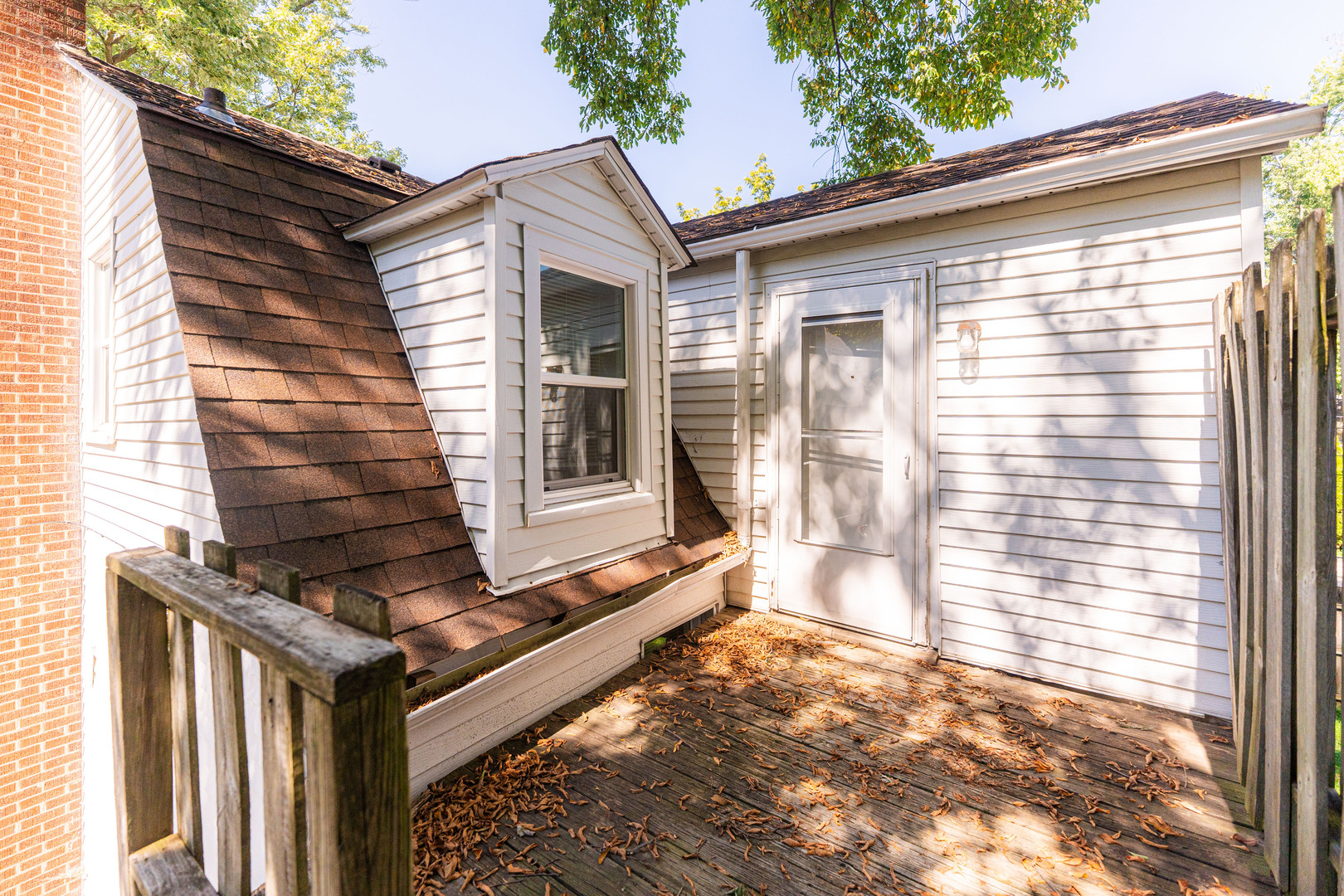 512 North 6th Street, Unit 2 DeKalb, IL 60115 - Photo 3 of 16 a front view of a house with a yard