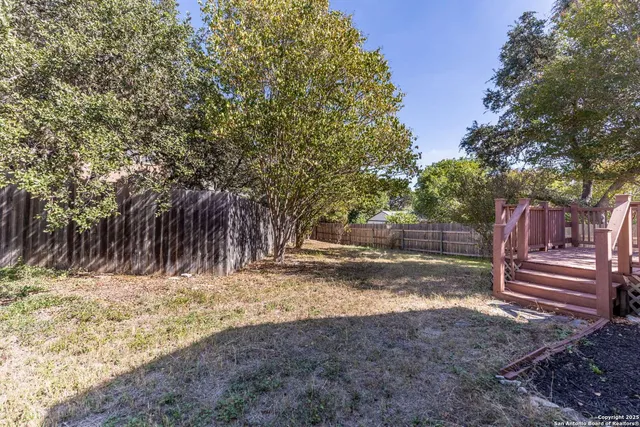 a view of backyard with tree