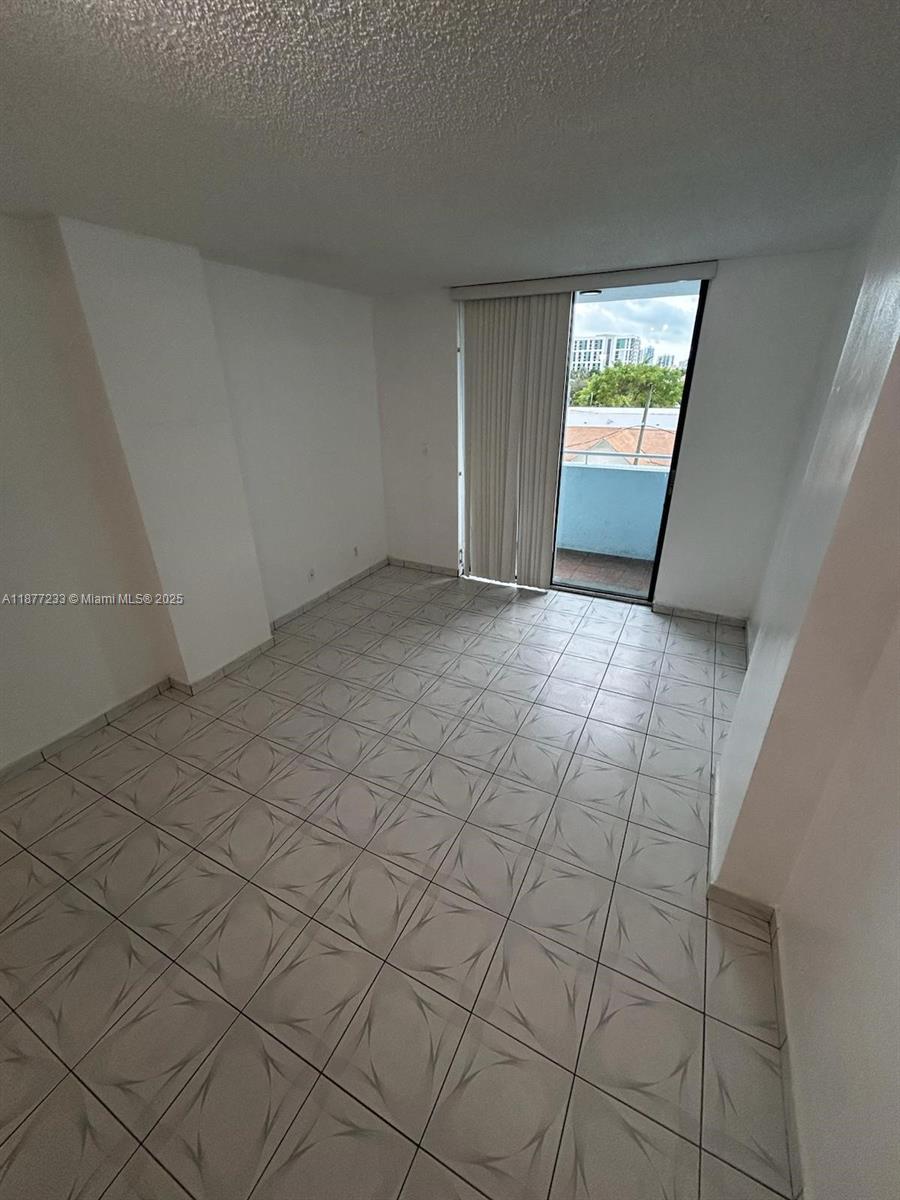 501 Southwest 1st Street, Unit 411 Miami, FL 33130 - Photo 14 of 18 a view of an empty room and window