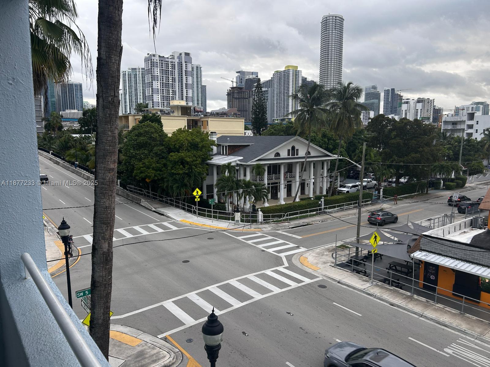 501 Southwest 1st Street, Unit 411 Miami, FL 33130 - Photo 16 of 18 a view of a city with tall buildings