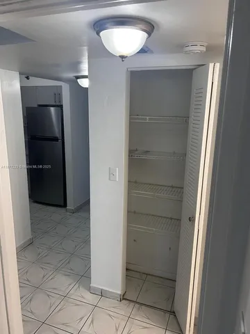 an empty room with a mirror