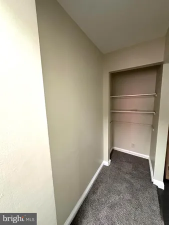 a view of an empty room with windows