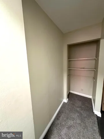 a view of an empty room with windows