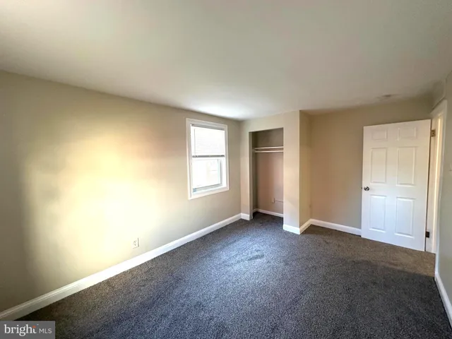 an empty room with a empty space and window