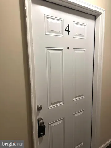 a kitchen with stainless steel appliances a refrigerator and a stove top oven