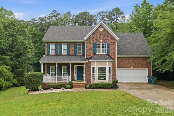 front view of a house with a yard