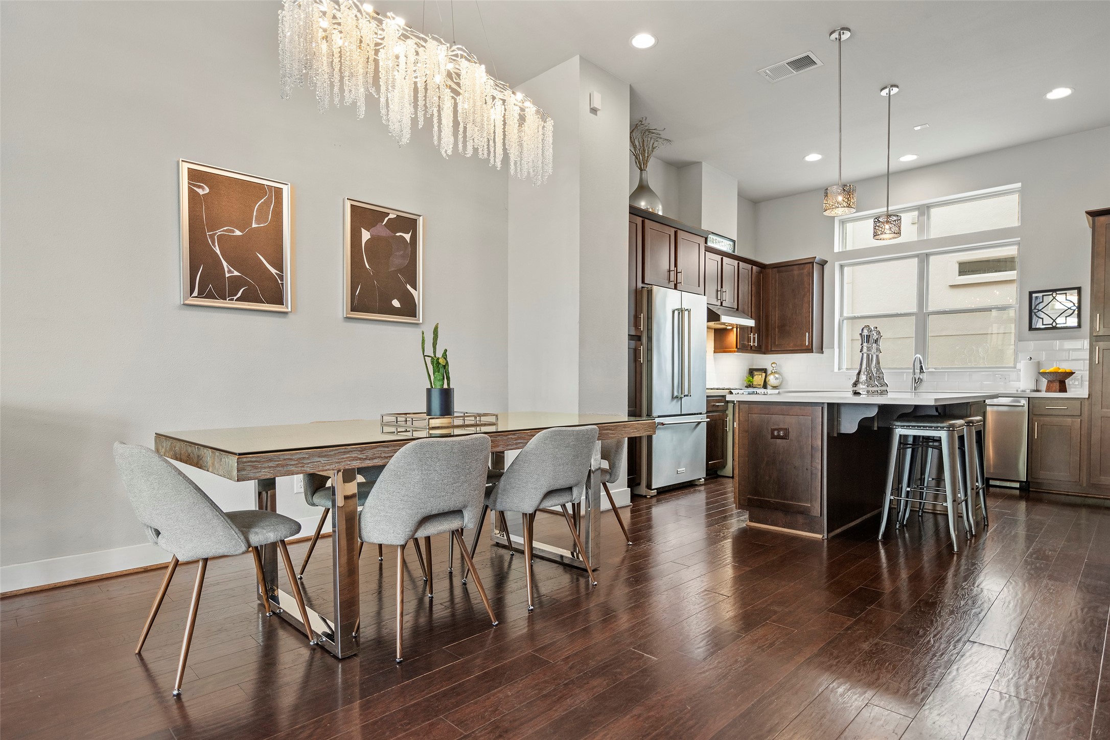 4413 Eli Street Houston, TX 77007 - Photo 11 of 47 a view of a dining room with furniture and wooden floor