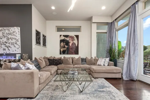 a living room with furniture and a large window