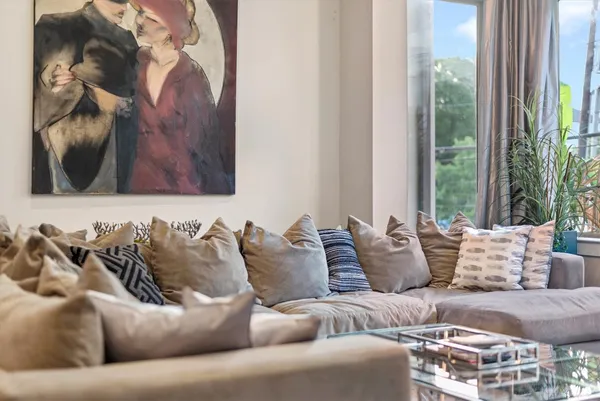 a living room with furniture and a large window