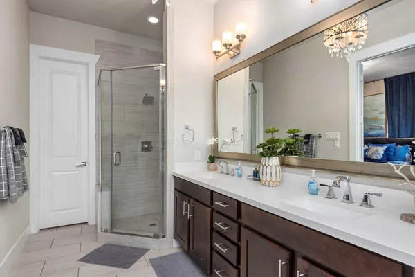 a bedroom with bed and wooden floor