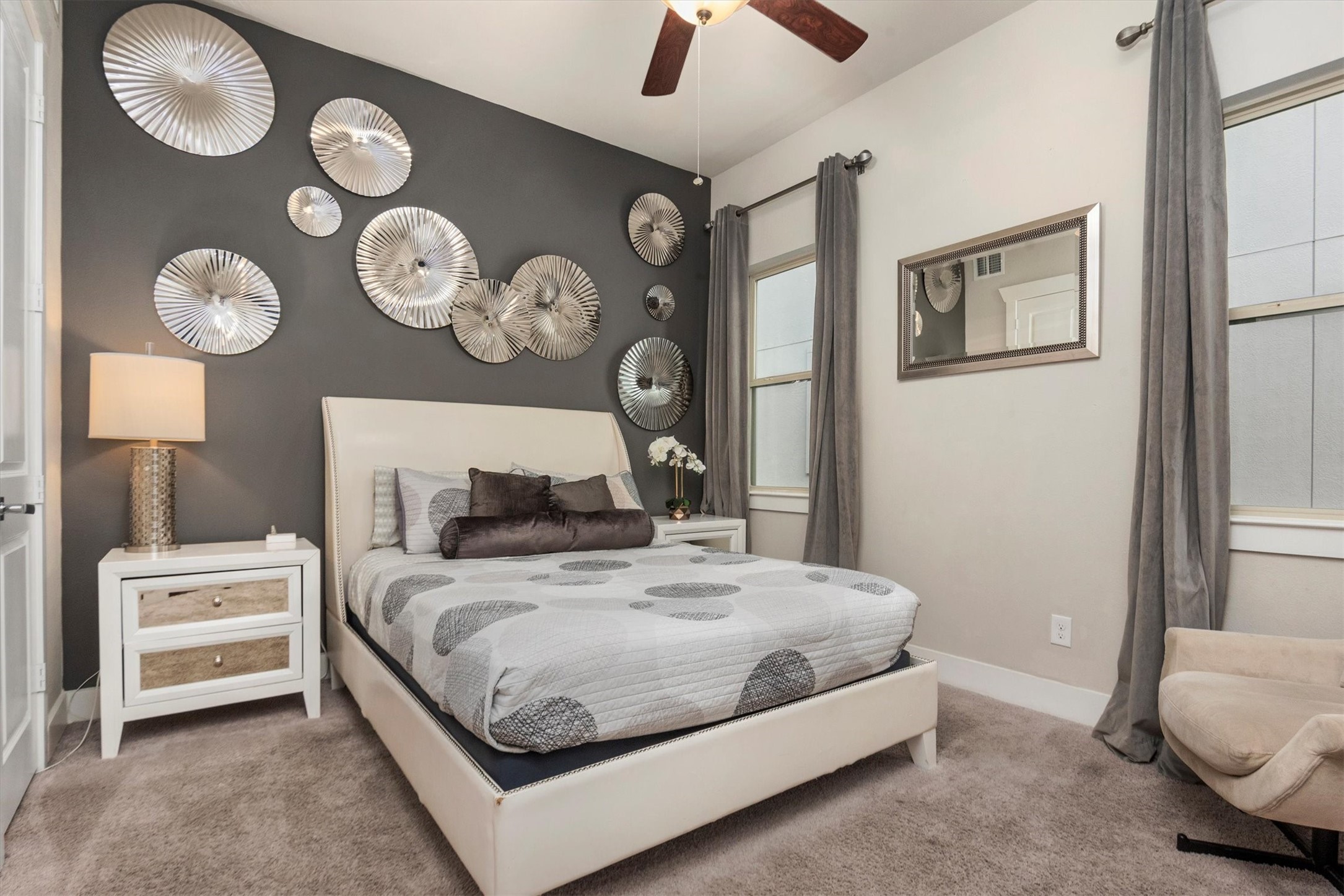 4413 Eli Street Houston, TX 77007 - Photo 38 of 47 a bedroom with a bed and a chandelier