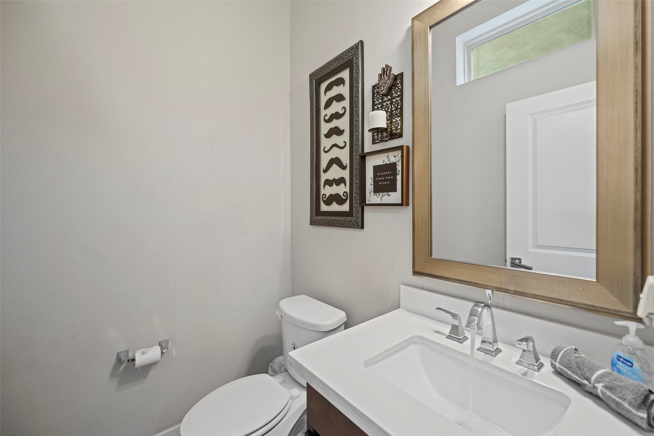 4413 Eli Street Houston, TX 77007 - Photo 42 of 47 a bathroom with a sink a toilet and mirror