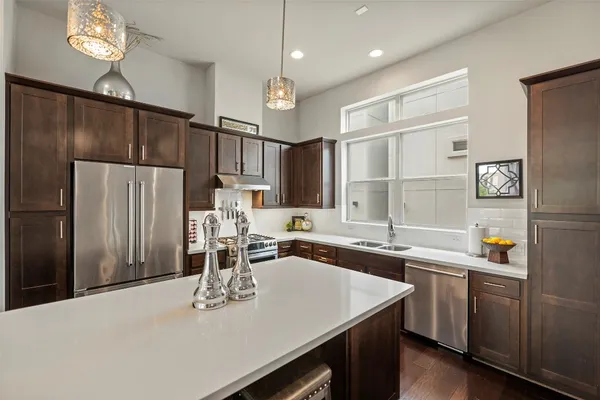 a kitchen with a sink and stove