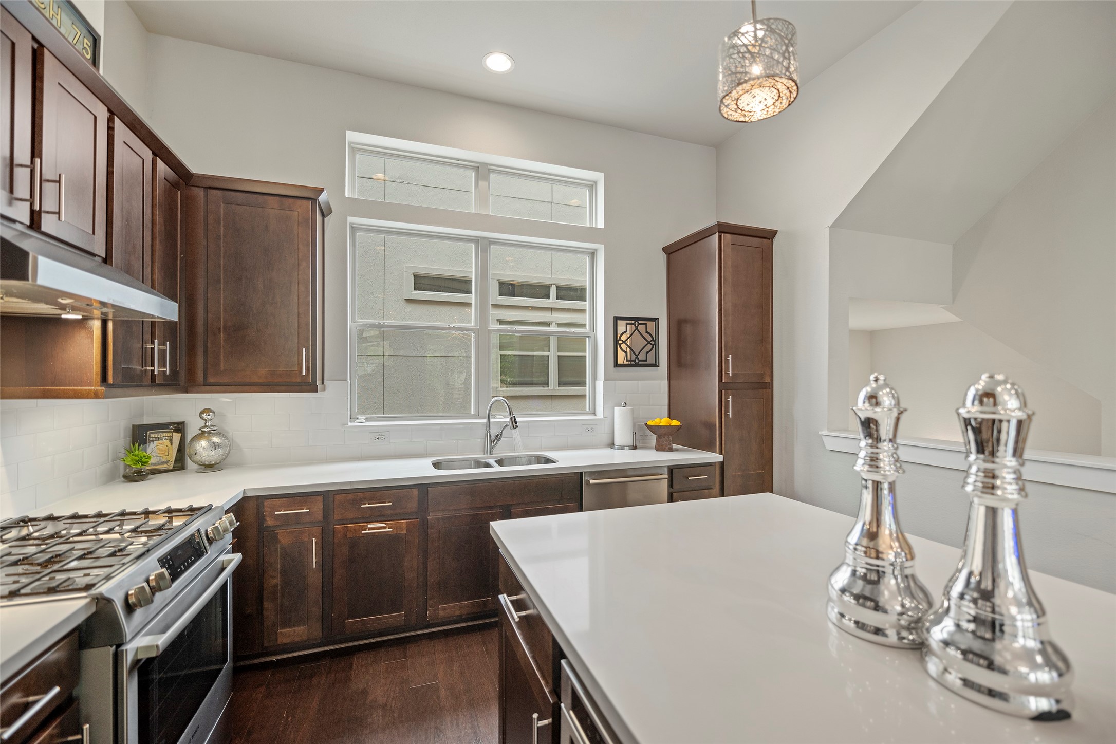 4413 Eli Street Houston, TX 77007 - Photo 9 of 47 a kitchen with a sink and stove