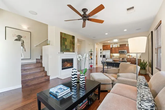 a living room with furniture fireplace and flat screen tv