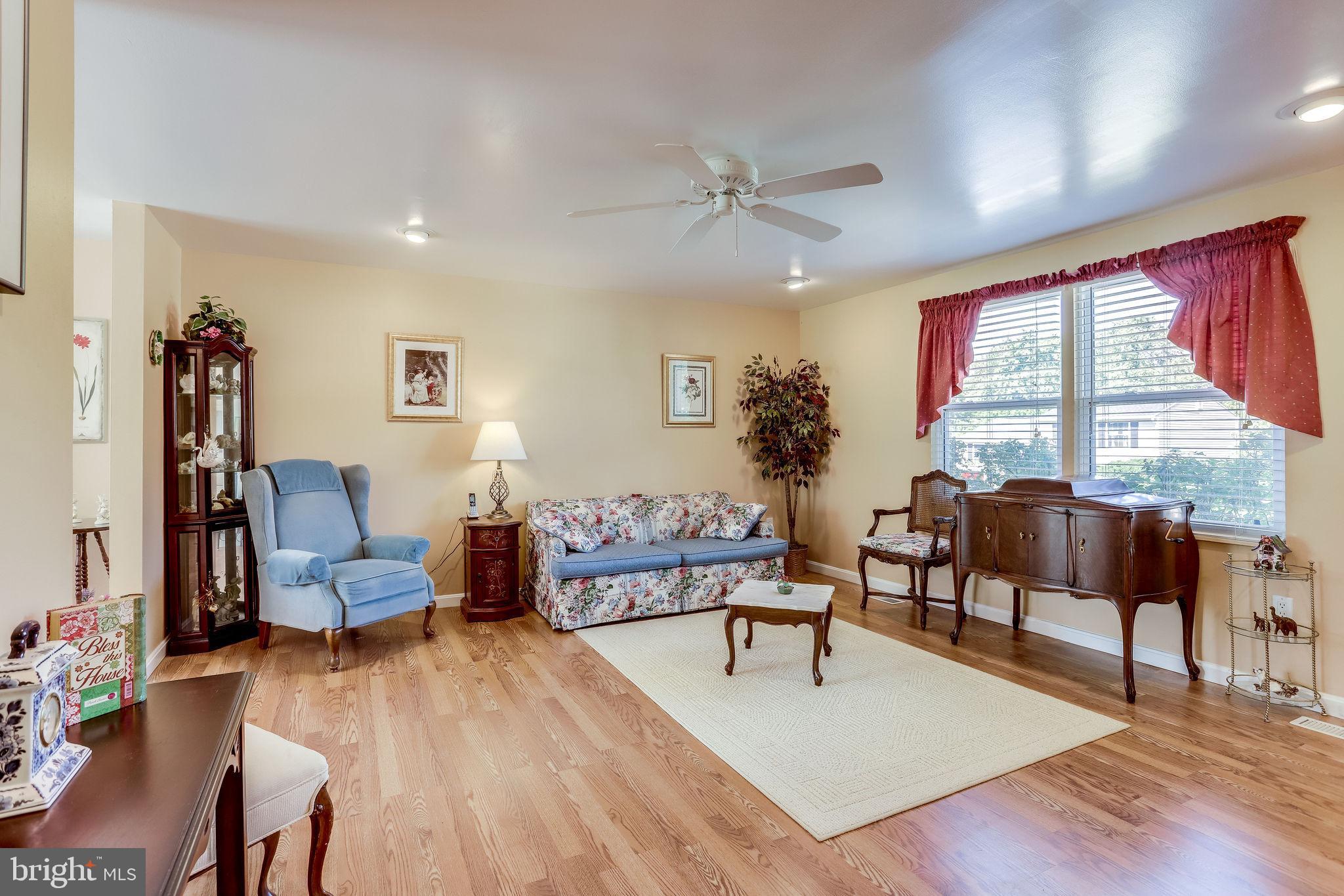 128 North Garfield Road Sterling, VA 20164 - Photo 3 of 39 Entertain guests in living room w/laminate floors